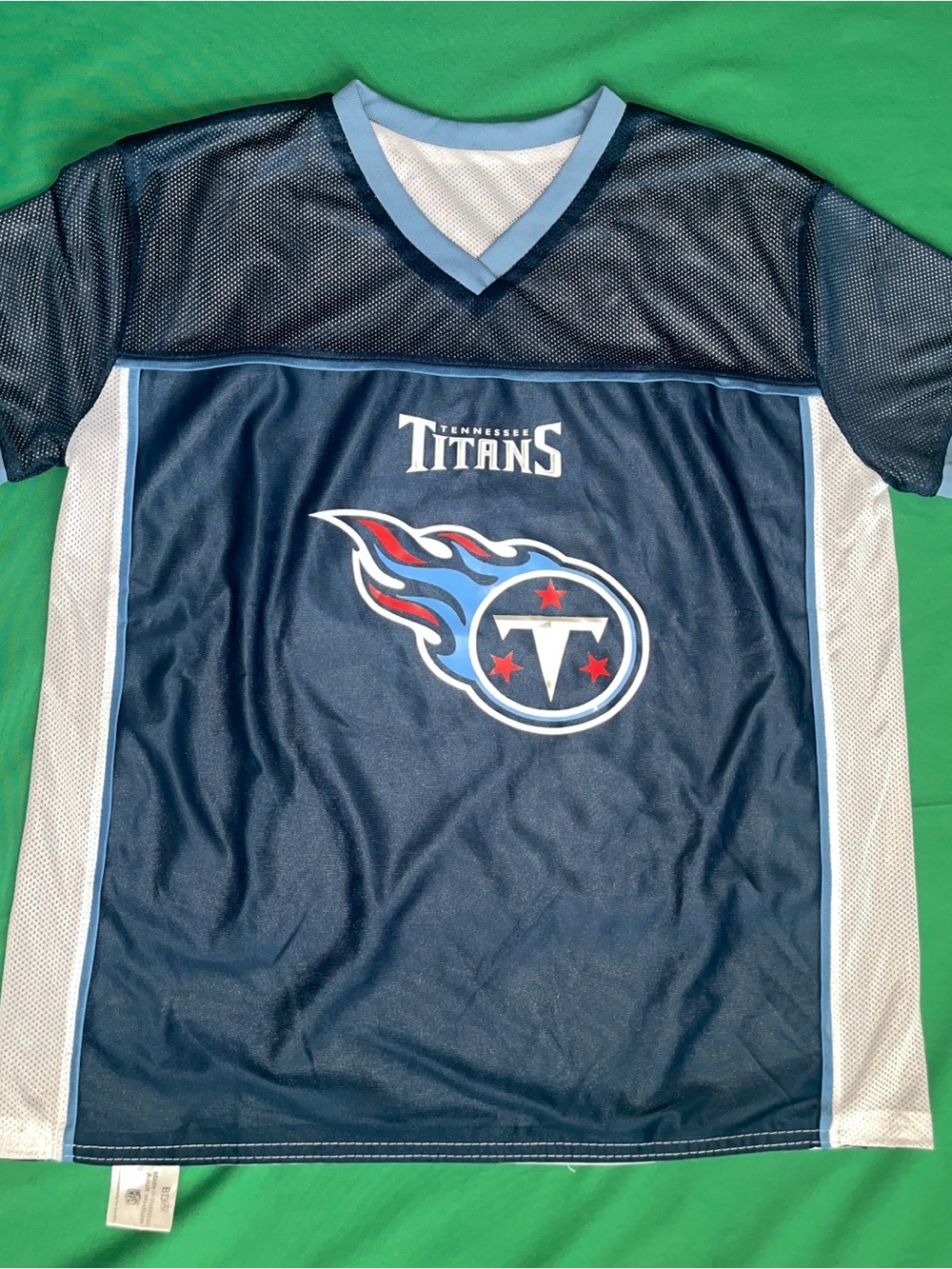 NFL Tennessee Titans blue jersey with white and light blue side panels, size M
